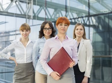Portrait of confident businesswomen standing together in office