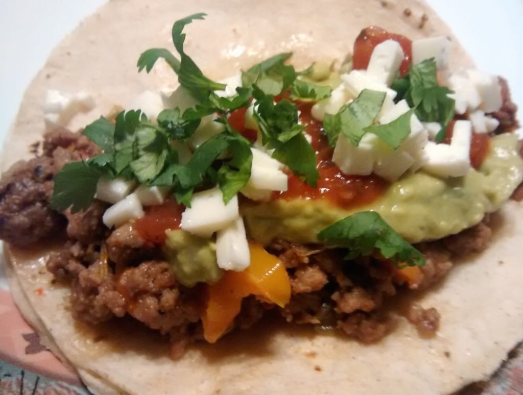 Soft shell taco with veggies and cheese